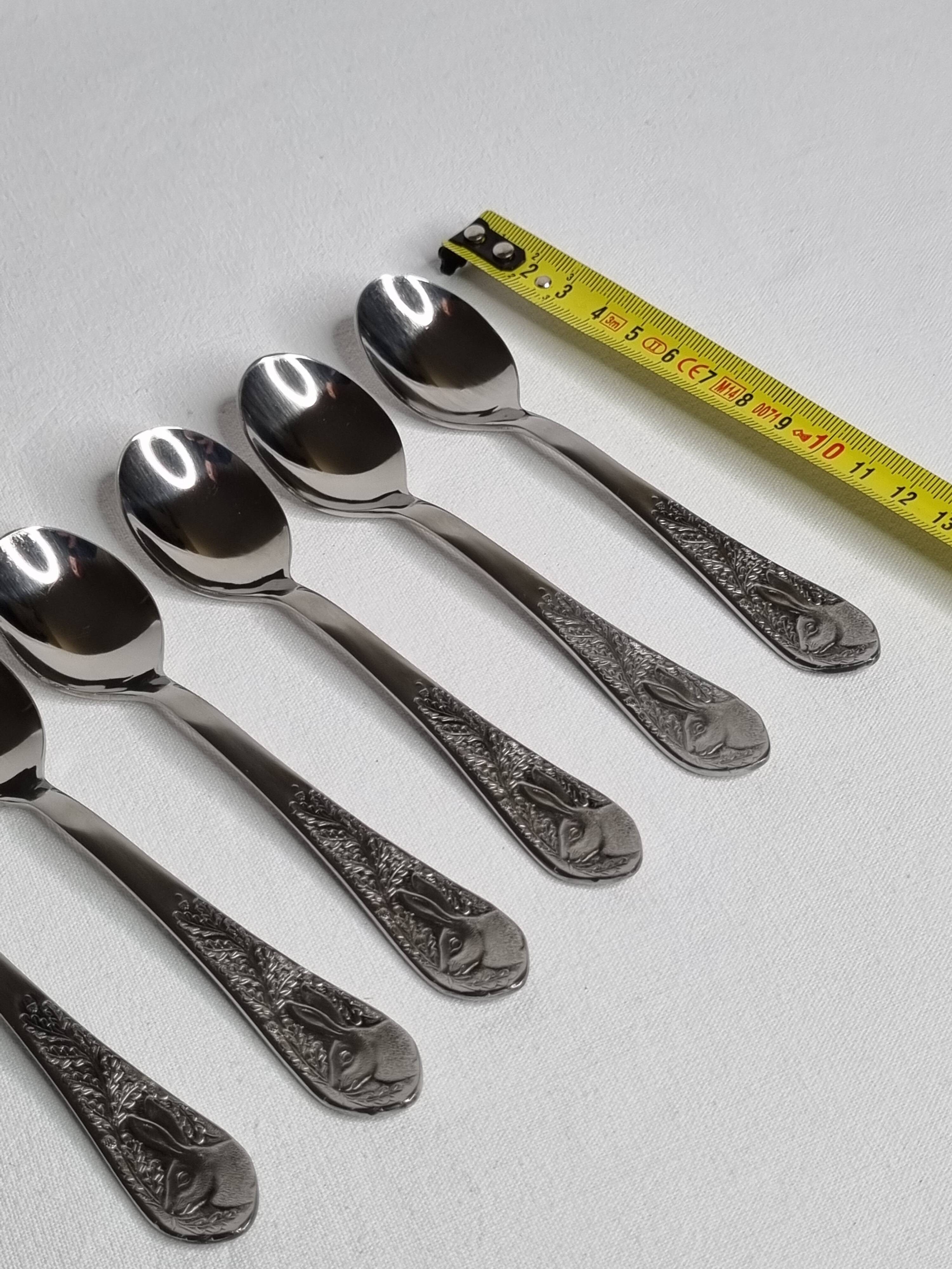 Set of six "Burgsil" stainless steel teaspoons with rabbit decoration