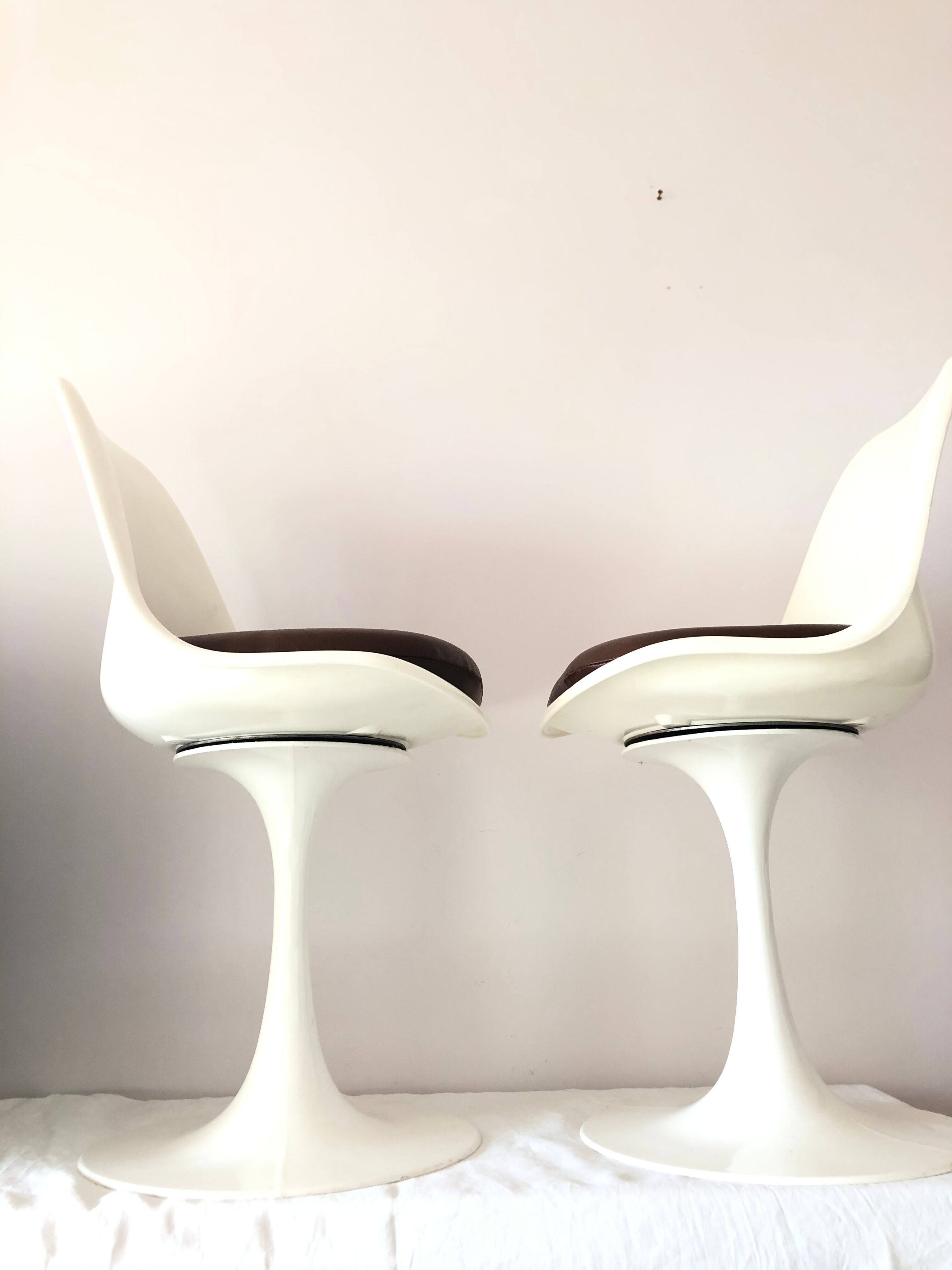 Pair of vintage tulip foot swivel chairs