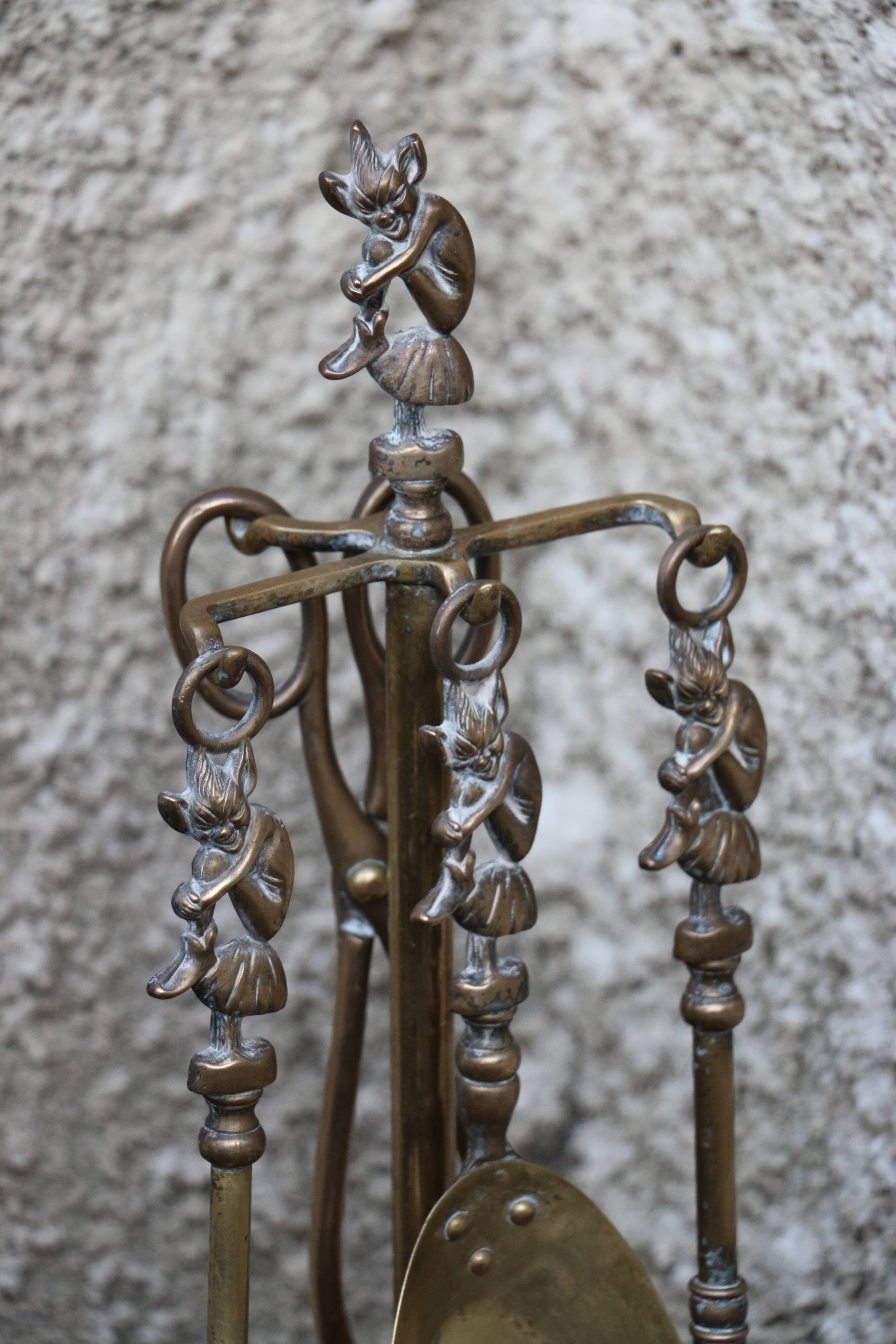 Brass fireplace servant with pair of cast iron pegs with vintage brass ball year 60