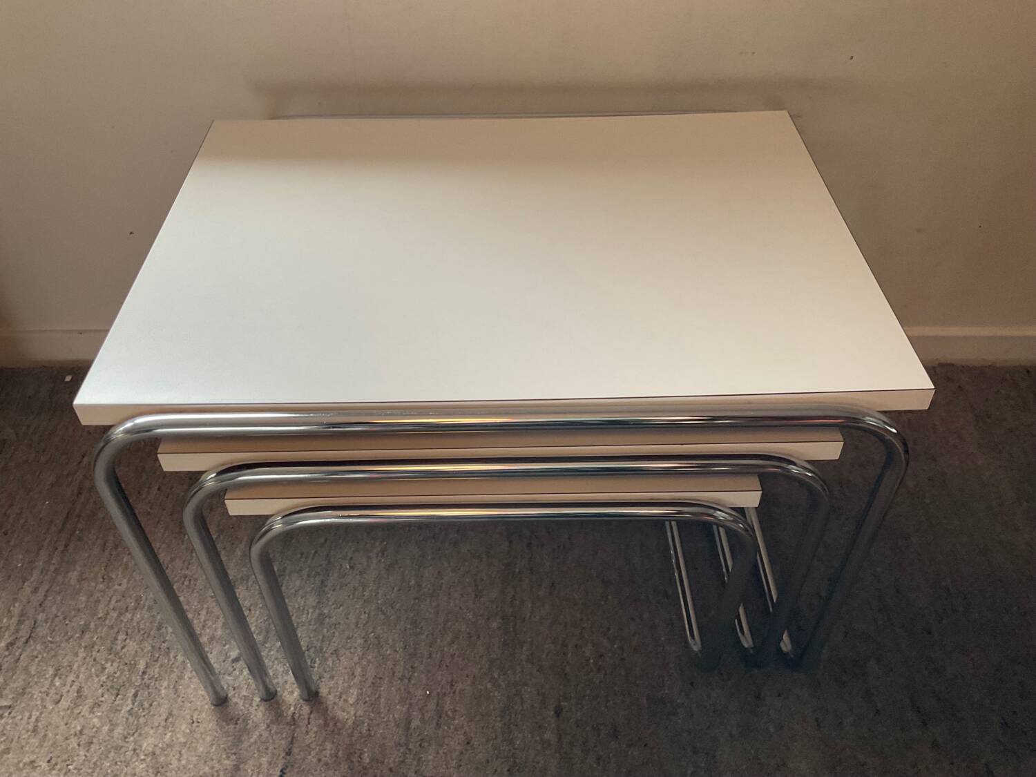 Trio of vintage nesting tables in Formica and chrome metal