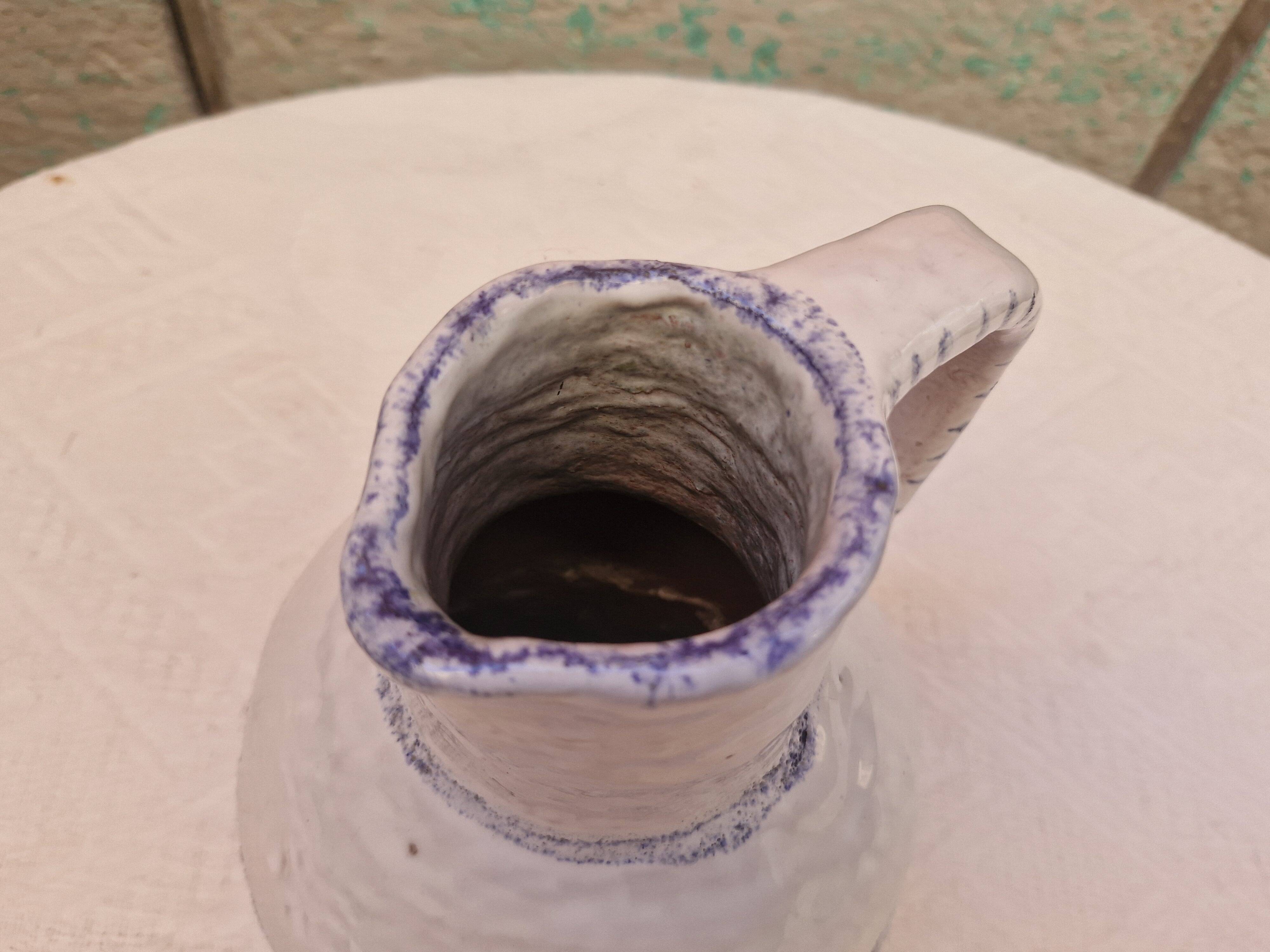Old stamped glazed terracotta jug