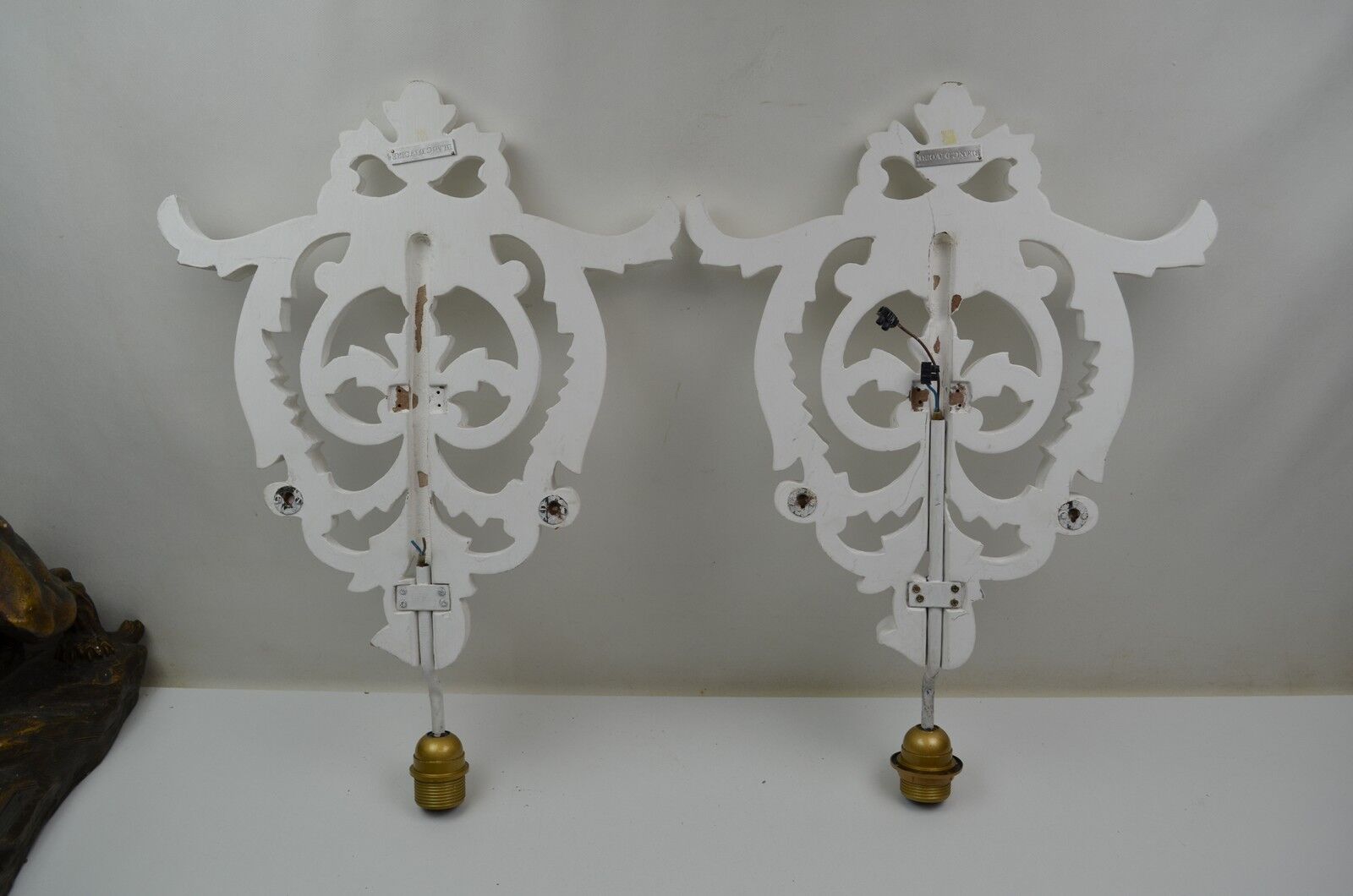 Pair of white patinated wood wall lamps