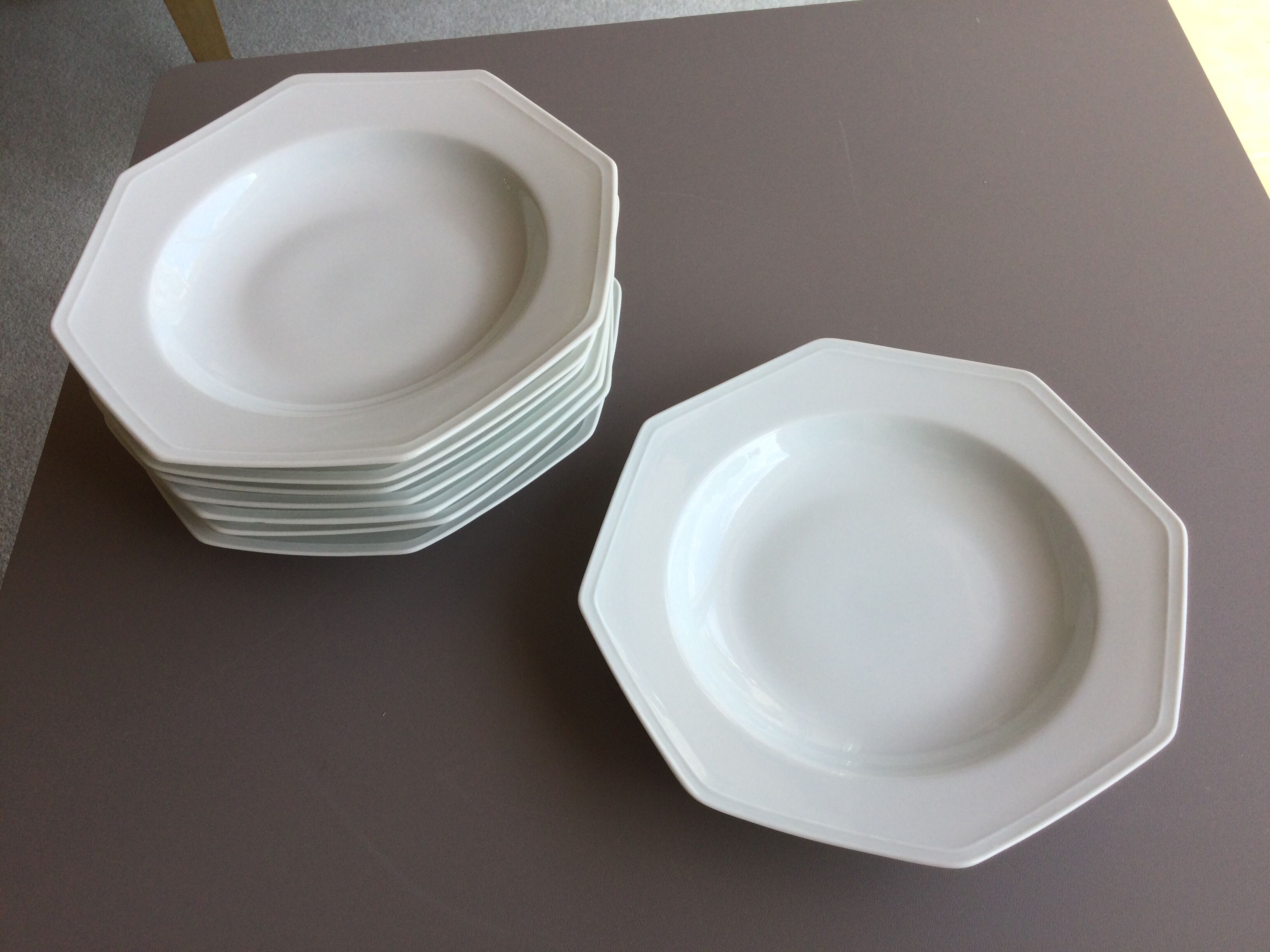 8 white hollow plates in Limoges porcelain