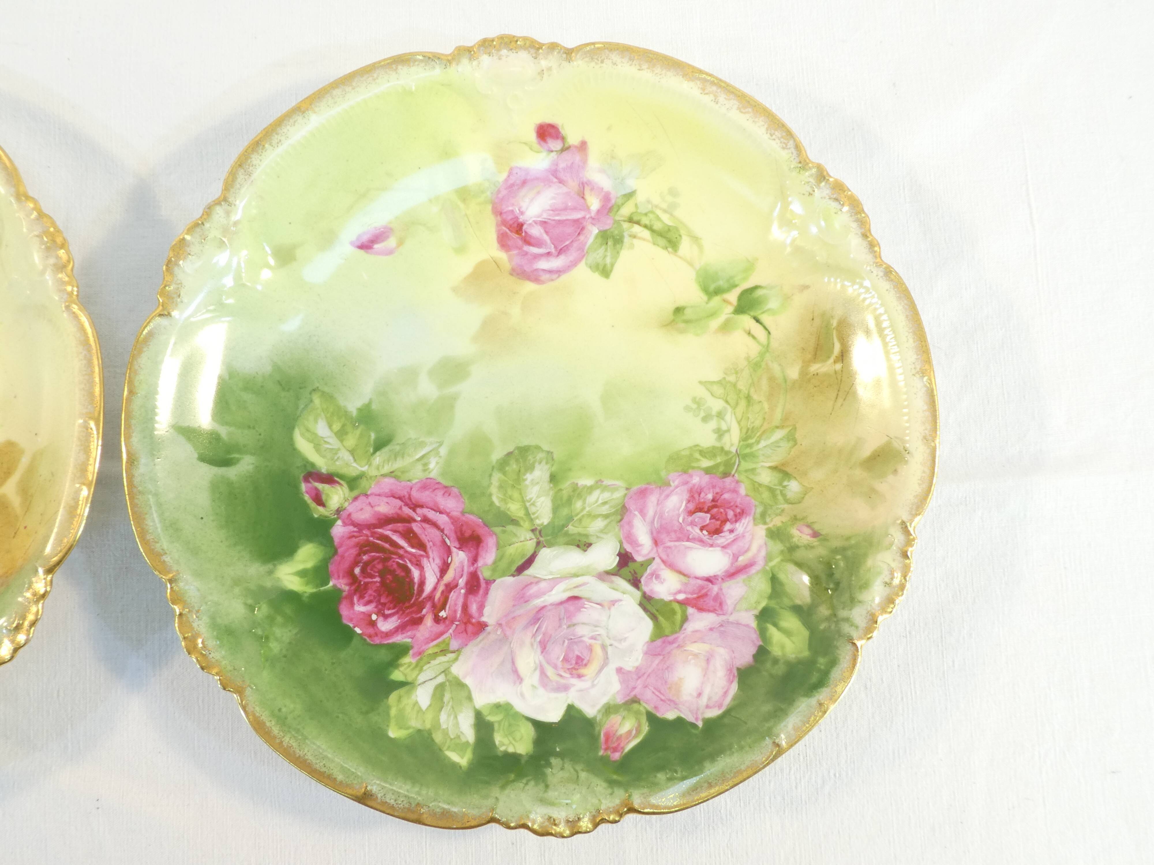 Pair of limoges porcelain plate ''Mandavy de mavaleix'' rose decoration