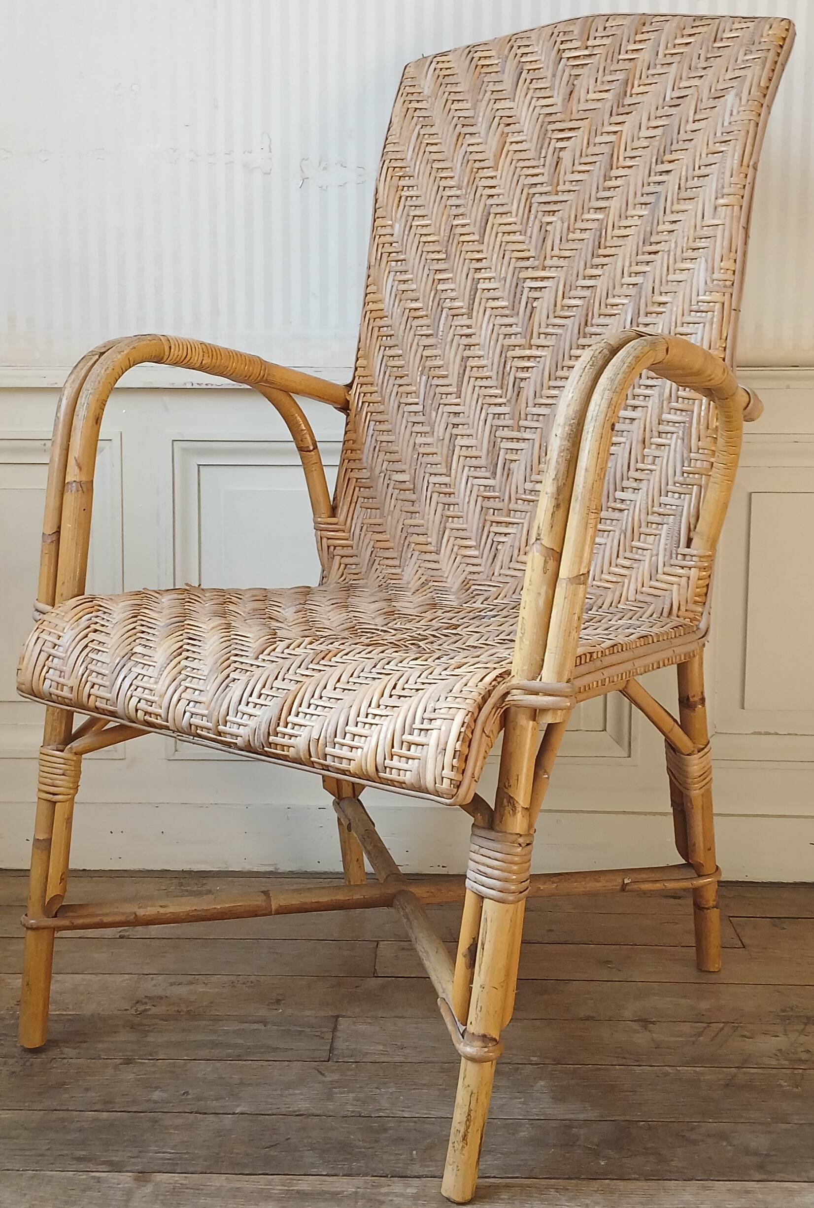 High-backed adult rattan armchair, circa 1960