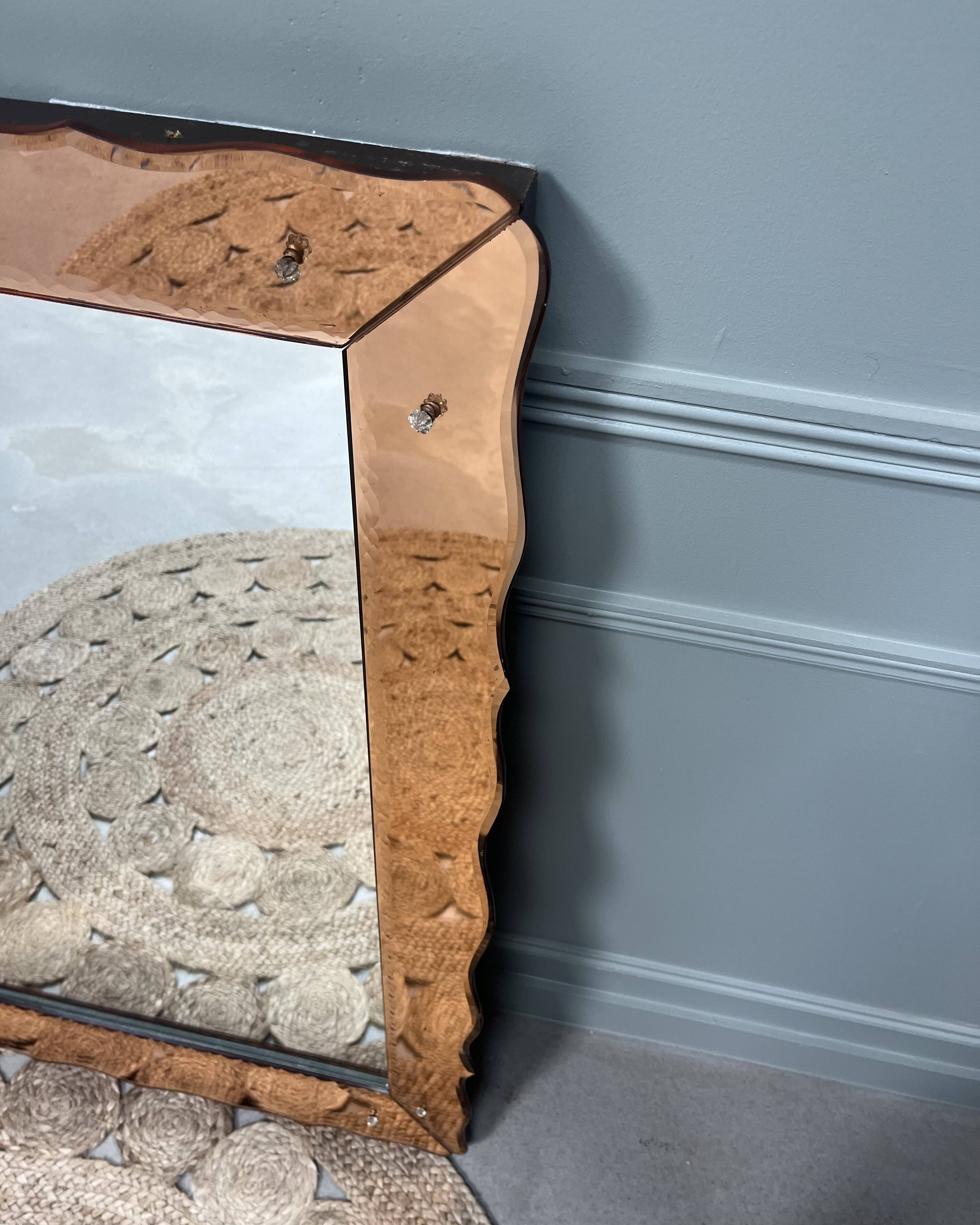 Large pink Venetian mirror
