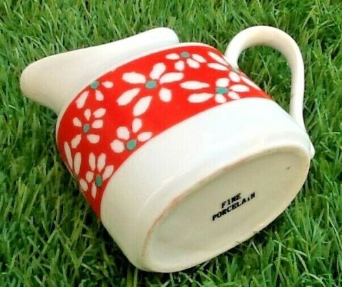 Suite of 6 coffee cups and milk pot, porcelain fine white with floral curly