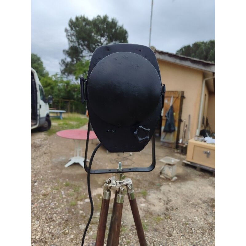 Spotlight on wooden and chrome tripod.