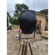 Spotlight on wooden and chrome tripod.