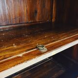 Antique red cabinet with brass details