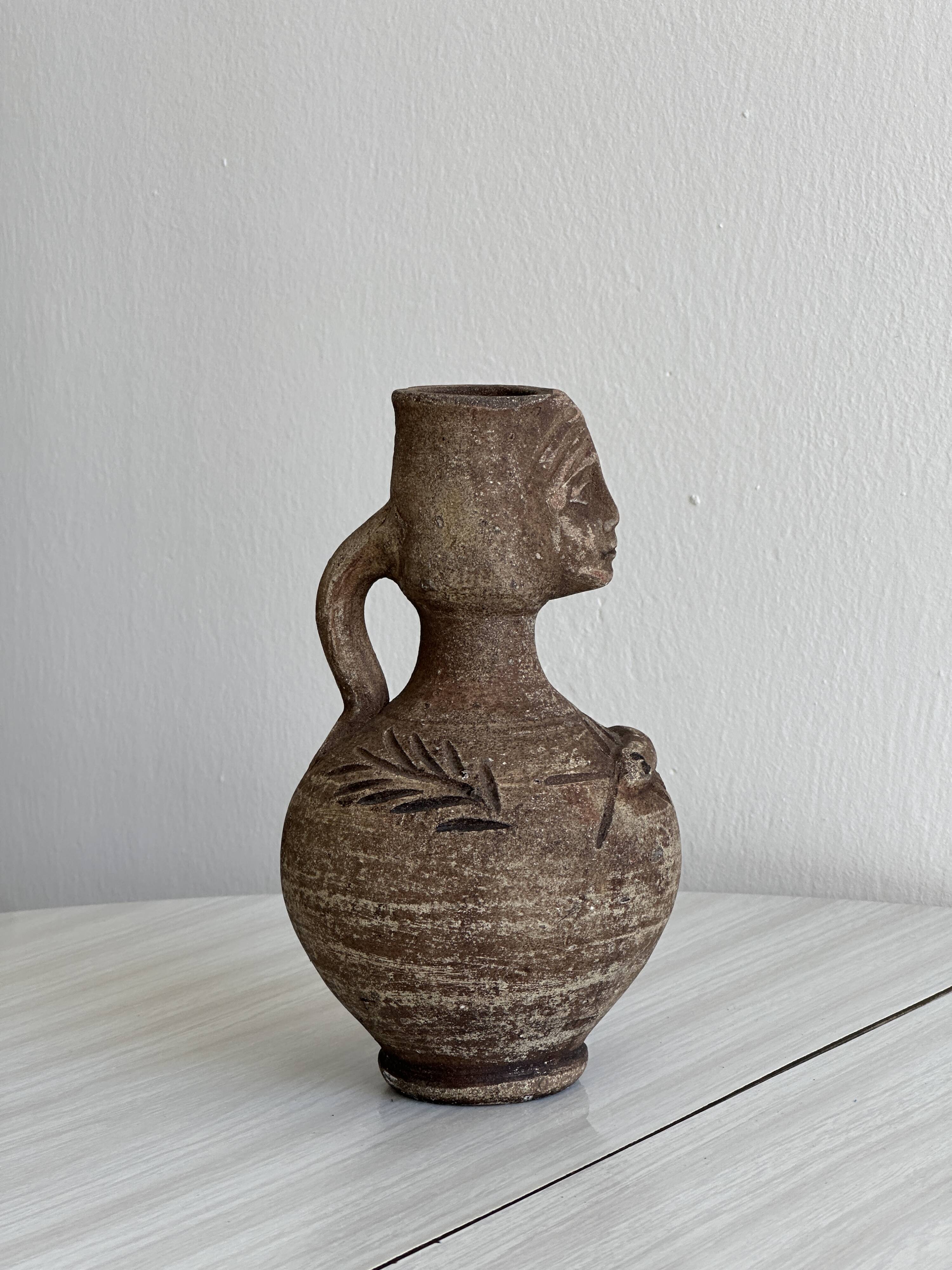 Decorative vase in raw terracotta