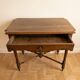 Antique walnut desk with a drawer and turned legs.