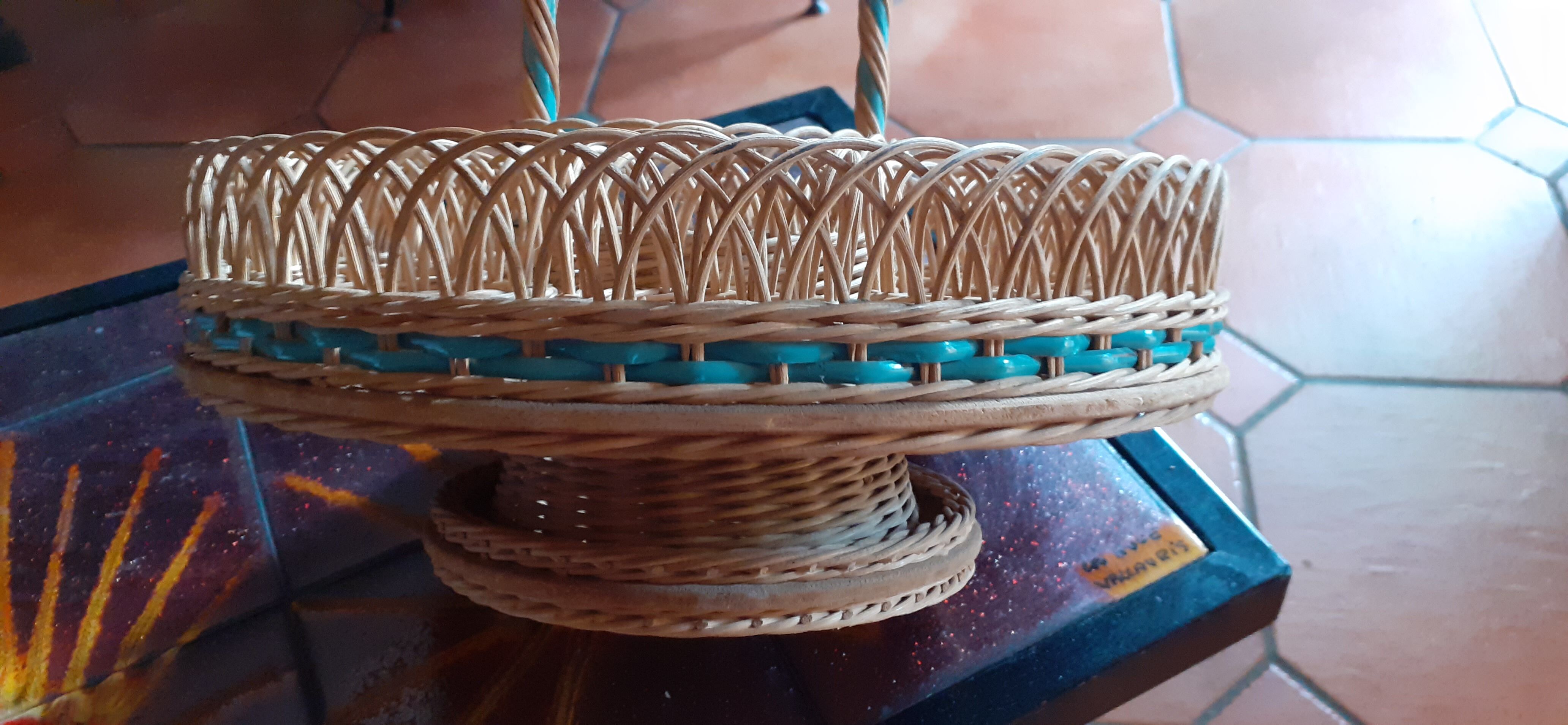 Glass holder and wicker bottle with green plastic water surface