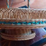 Glass holder and wicker bottle with green plastic water surface