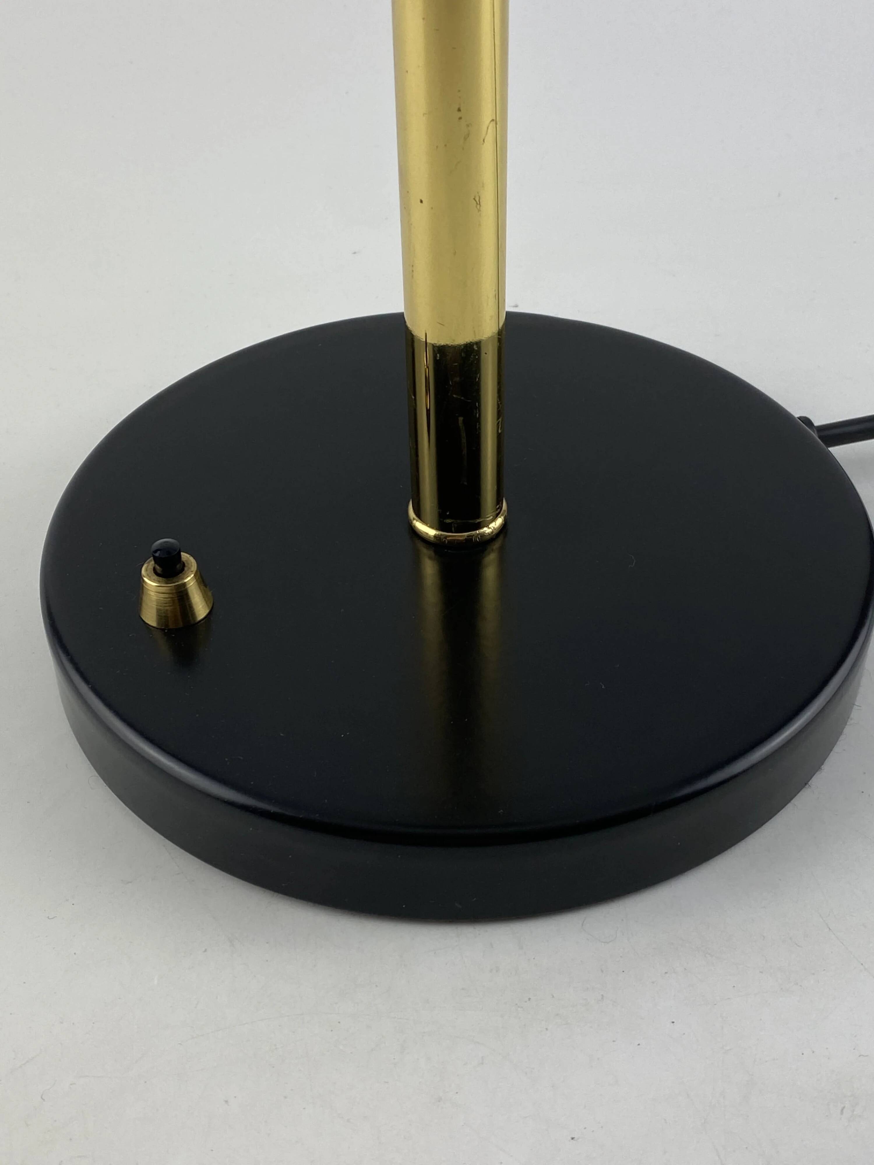 Rare black and gold UFO table lamp by Louis Kalff for Philips.
