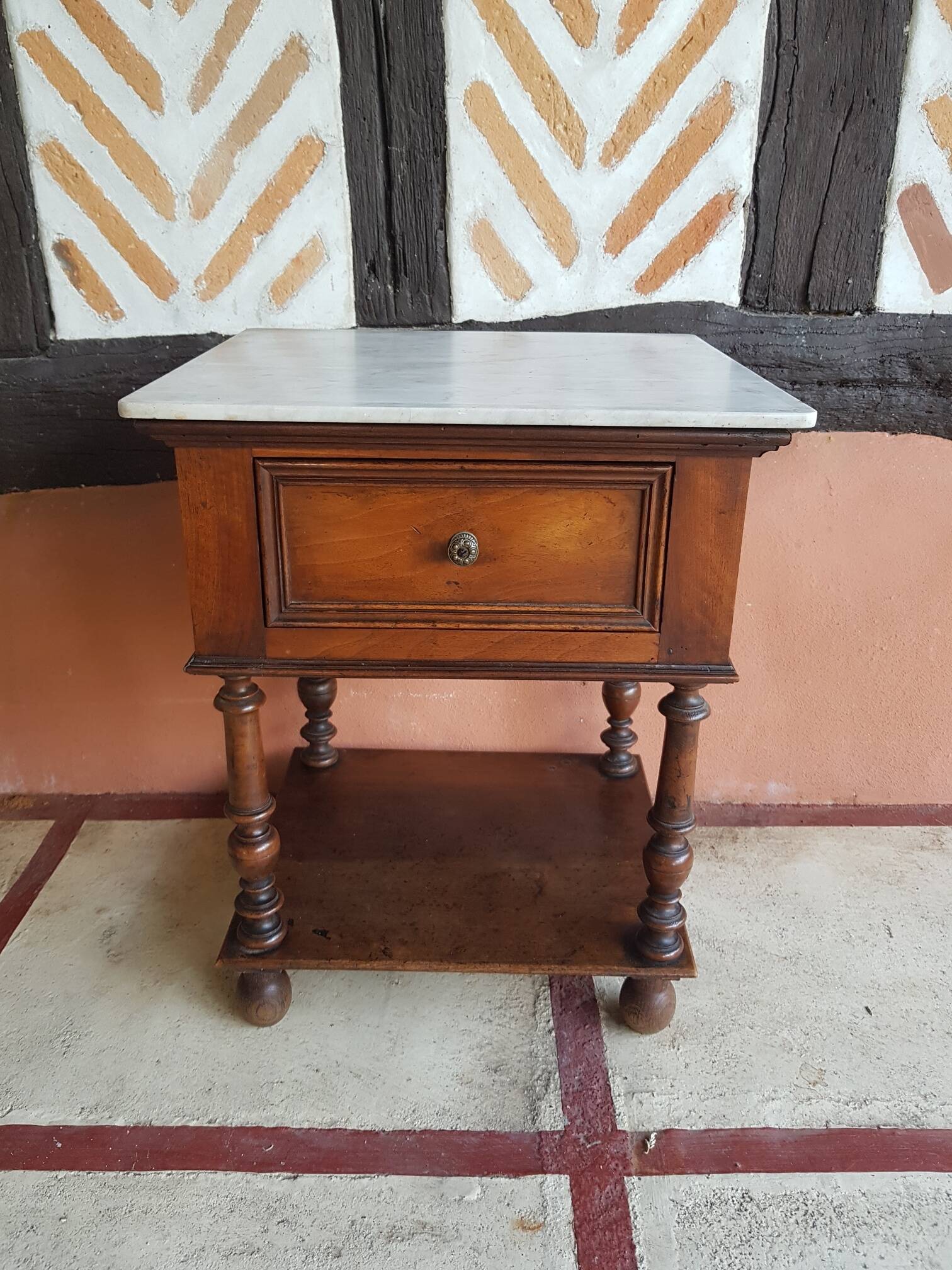 Old wooden marble bedside table