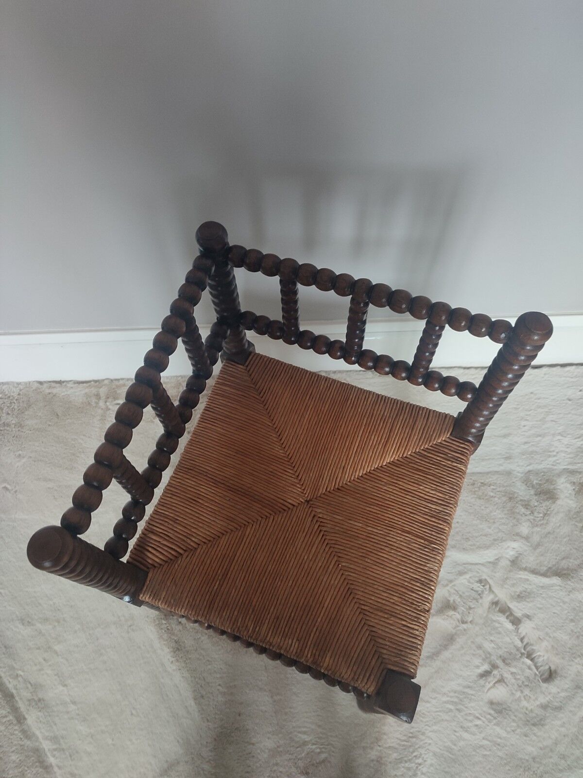 Turned wooden corner chair