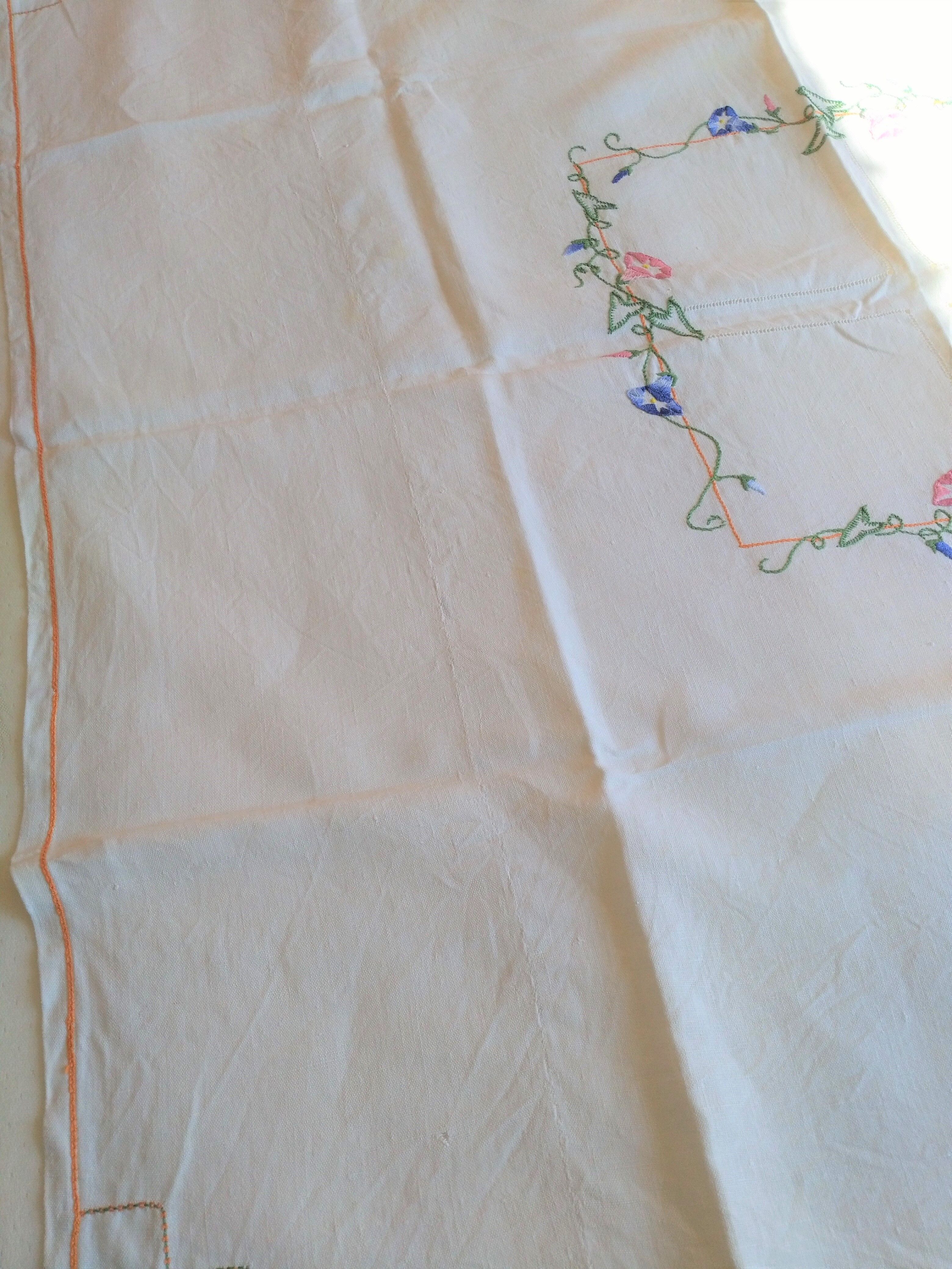 Antique linen tablecloth embroidered with flowers