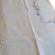 Antique linen tablecloth embroidered with flowers