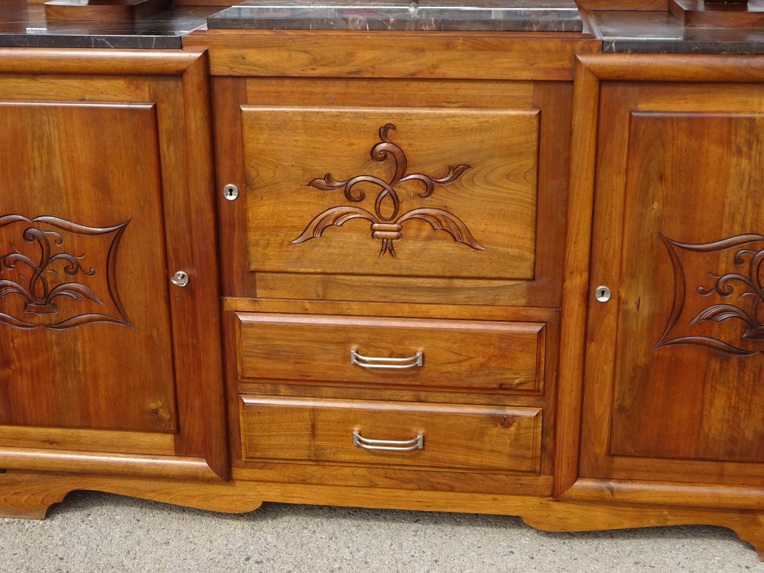 Solid walnut sideboard, moustache legs, black marble top.