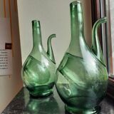 Pair of blown glass wine decanters in blue/green hues.