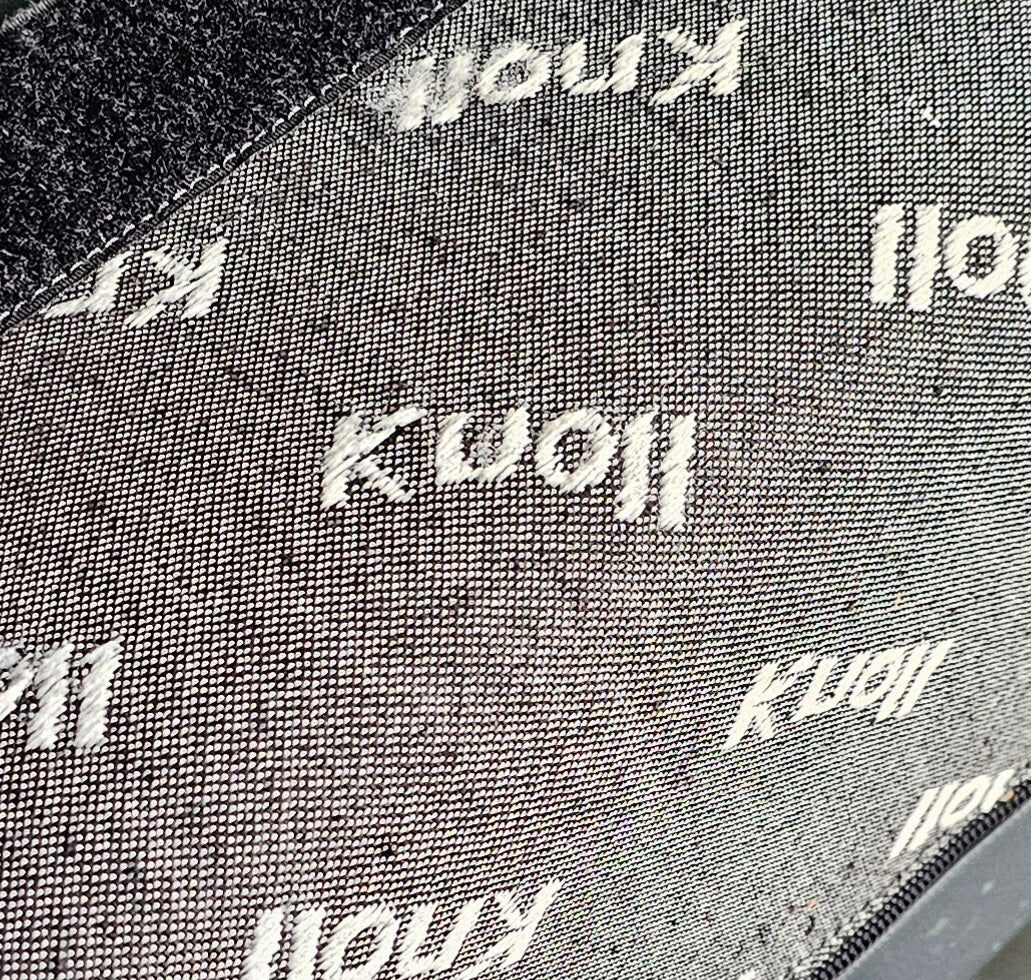 Pair / Trix and Robert Haussmann / Dark grey leather chairs by Knoll