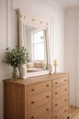 Antique bevelled mirror, frame in pearl grey patinated wood.