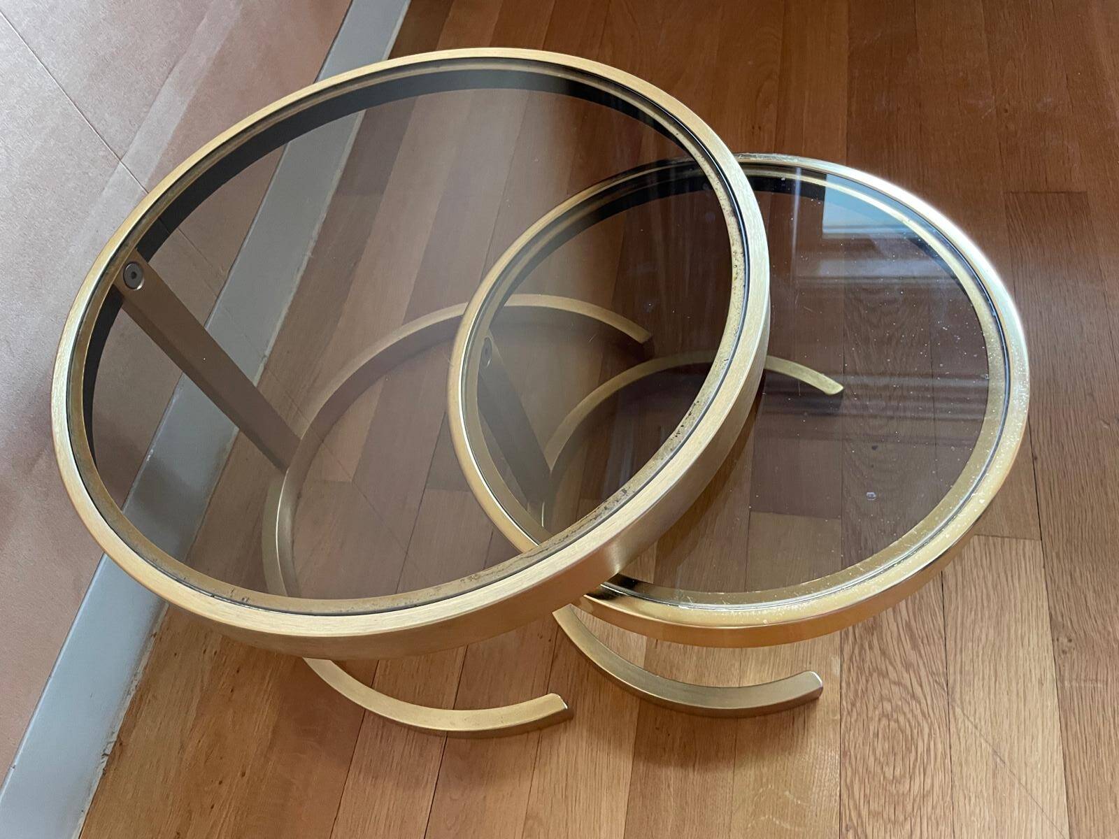 Nest of coffee tables in glass and brass.
