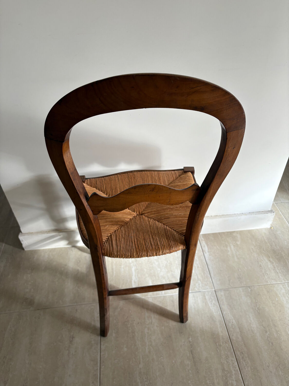 Antique wooden chair with woven straw seat – rustic style