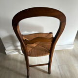 Antique wooden chair with woven straw seat – rustic style