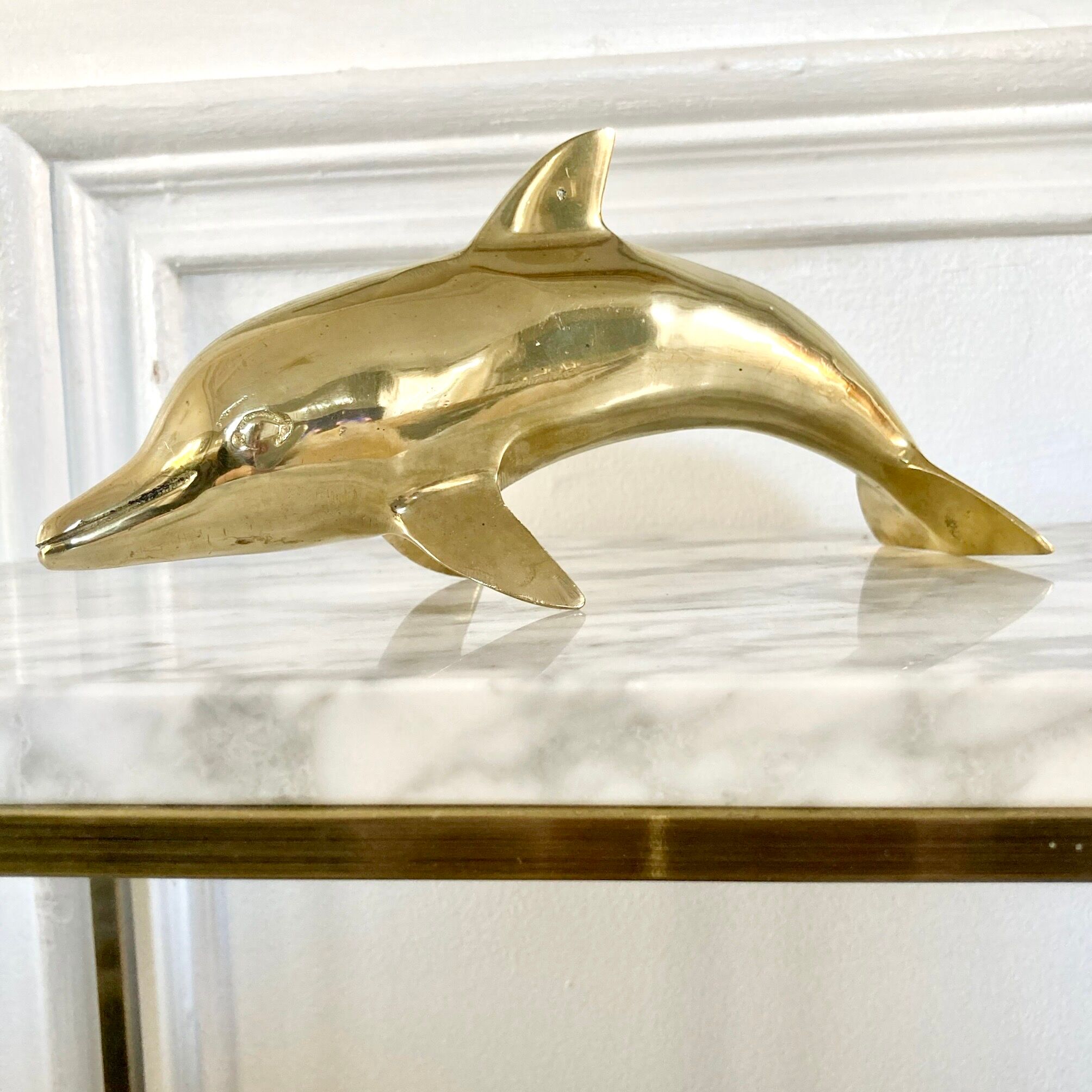 Vintage brass dolphin