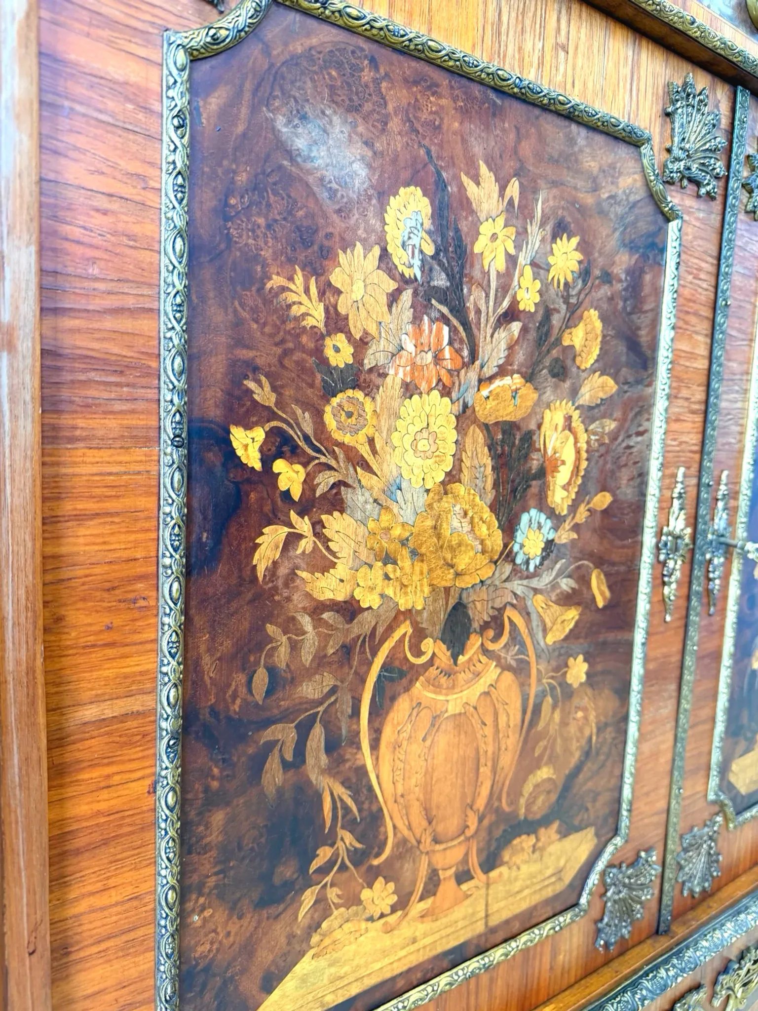 An antique French Louis XVI-style marble-top side cabinet