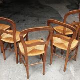 6 rustic straw chairs.