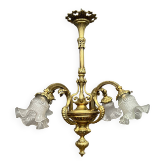 Antique chandelier in solid gilded bronze.