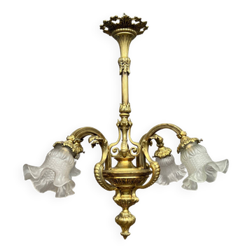 Antique chandelier in solid gilded bronze.