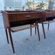 Modernist Danish teak bedside tables with rattan shelves, set of 2