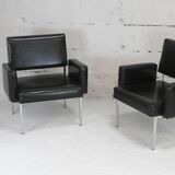 Pair of stainless steel, black leather-like armchairs, France, circa 1970