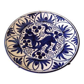 Hand-painted decorative plate decorated with a blue chimera pattern