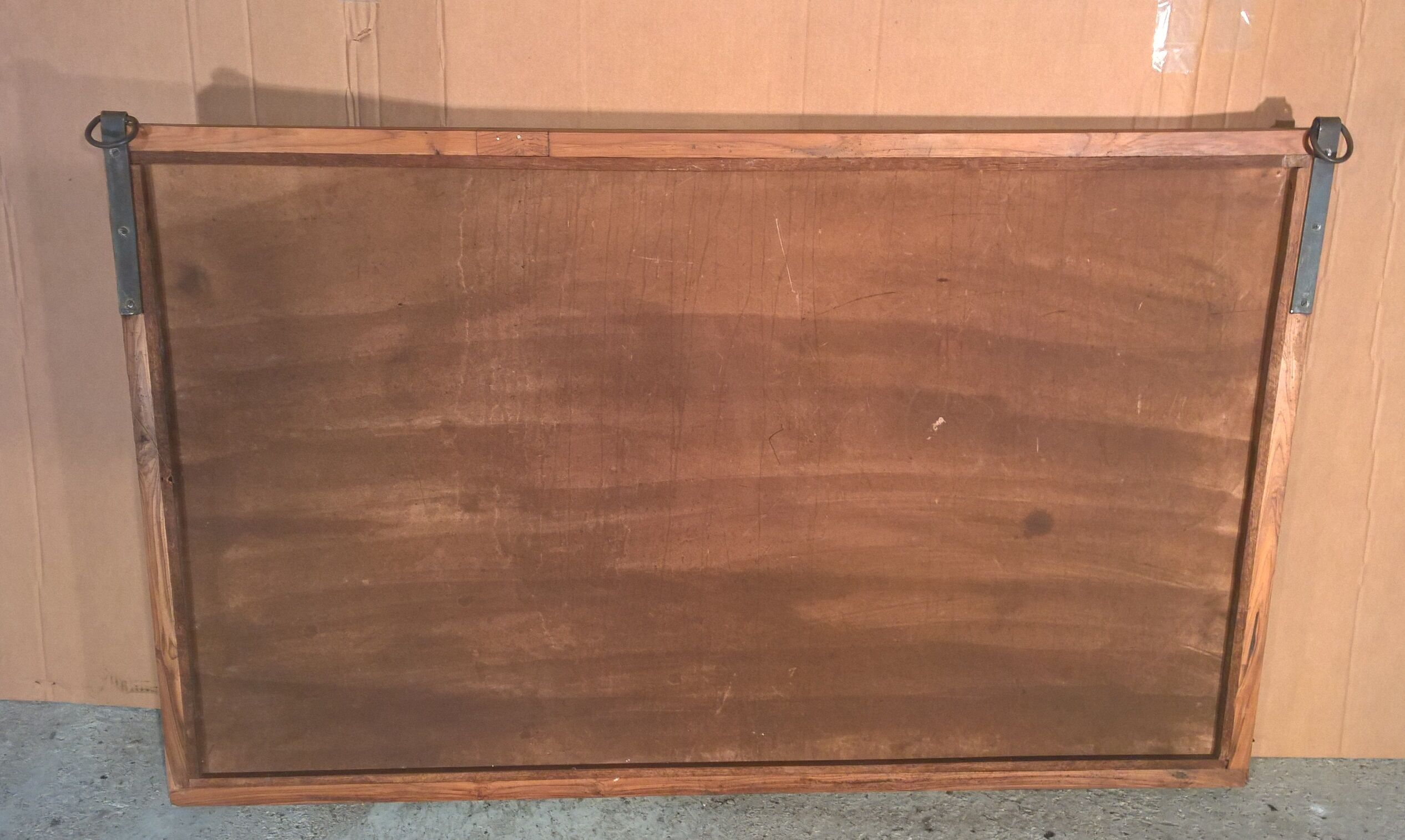 Old wrought iron railing with mirror and teak frame