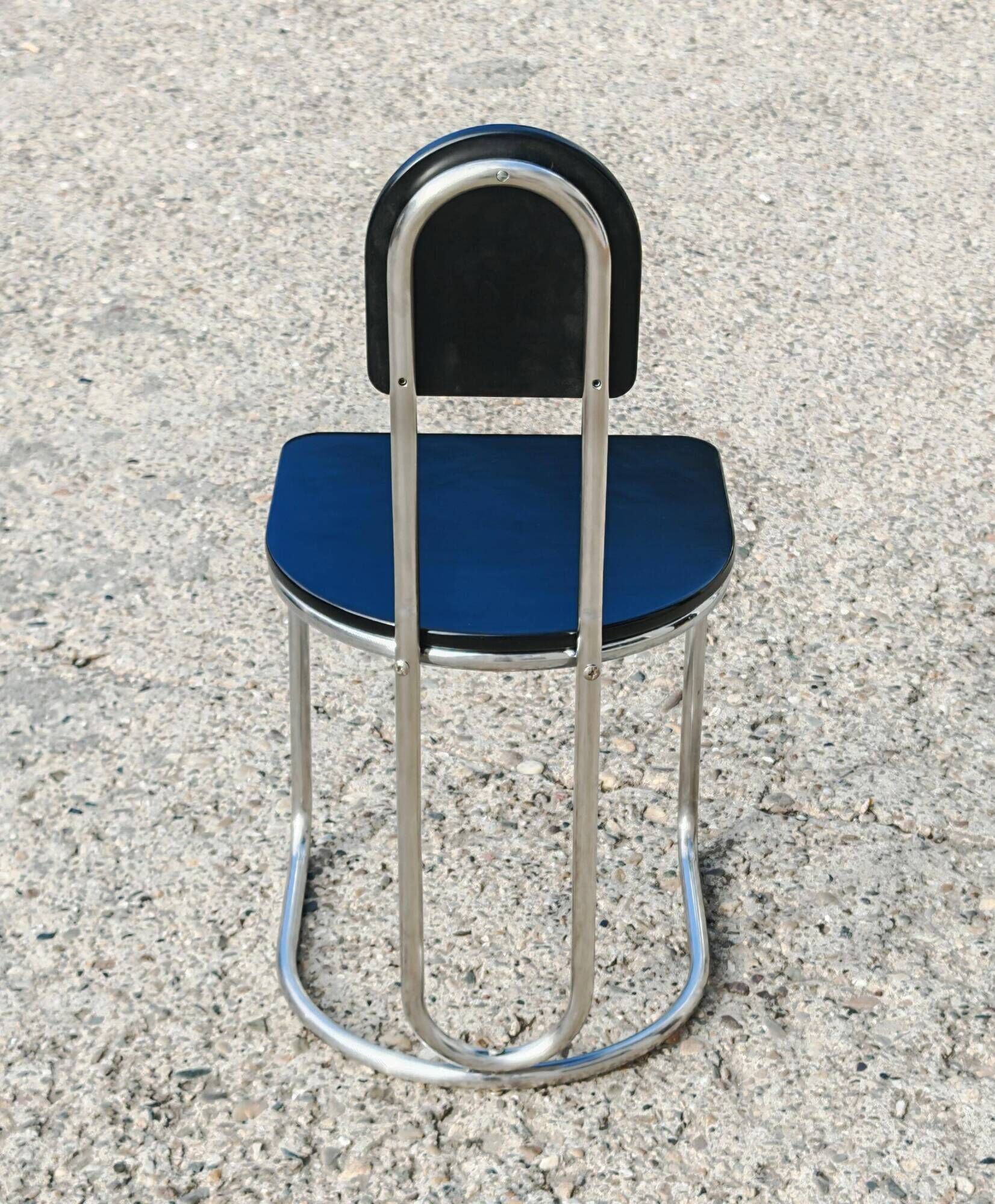 Set of 4 Bauhaus tubular steel chairs with wooden seats.