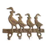 Wall-mounted tea towel holder or key holder in brass with ducks.
