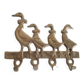 Wall-mounted tea towel holder or key holder in brass with ducks.