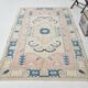 Tapis vintage en laine et coton pêche et bleu