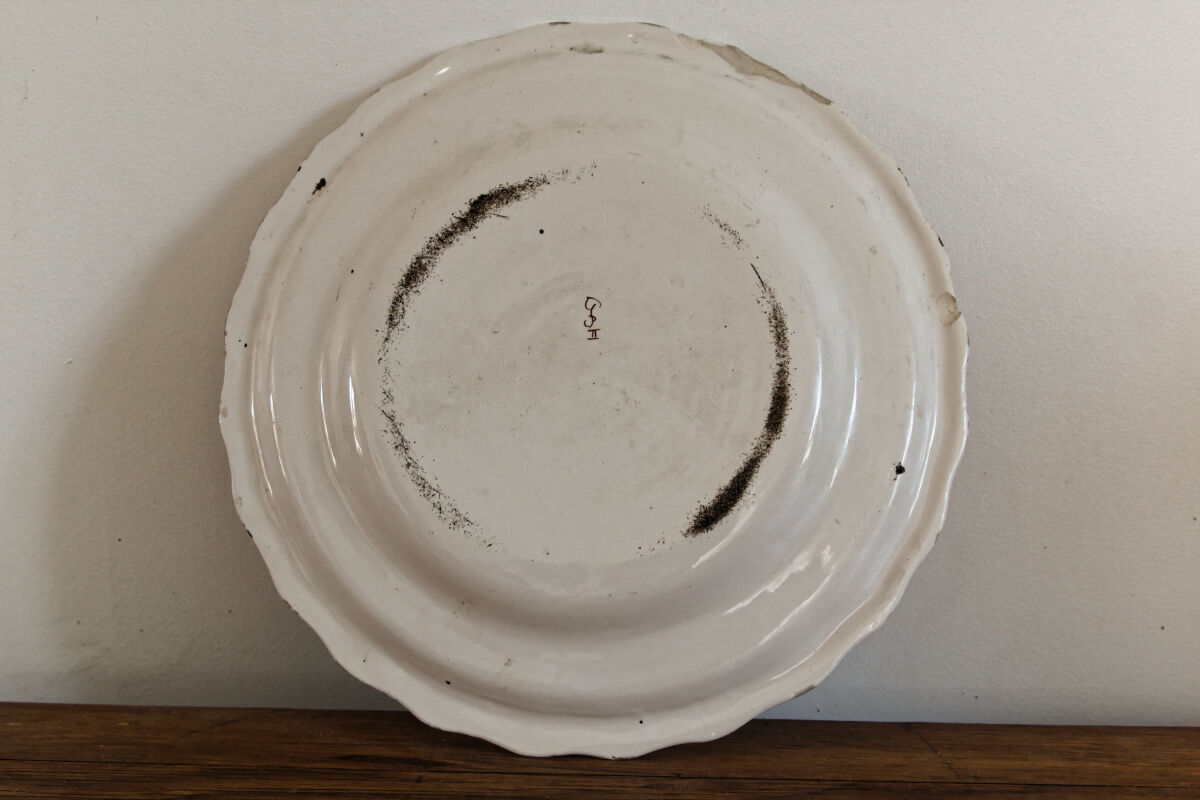 Signed Moustiers plate, in yellow shades