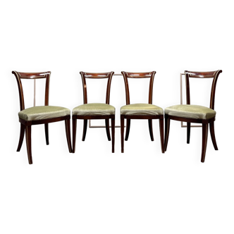 Suite of four directoire style mahogany and gilded wood chairs