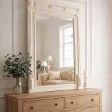 Antique bevelled mirror, frame in pearl grey patinated wood.