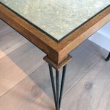 Patinated and gilded steel coffee table in the style of Jacques Quinet.