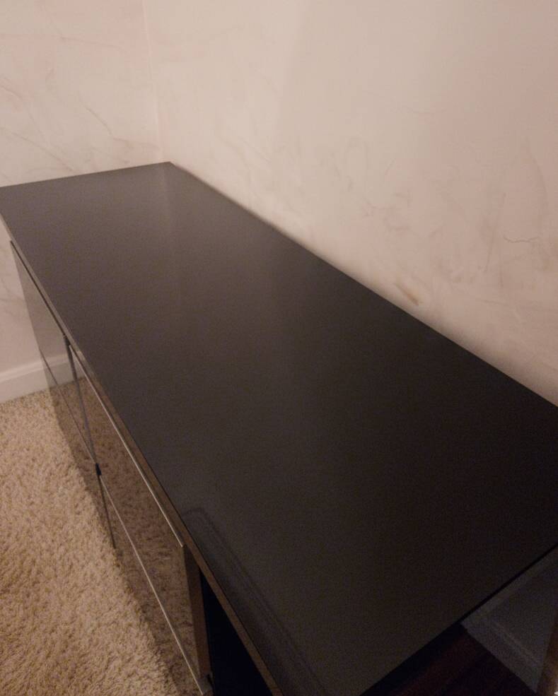 Black lacquered 4-drawer cabinet by David Lange with a lacquered top.