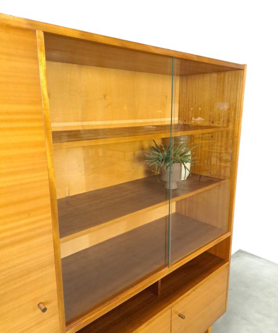 Vintage wooden sideboard with sliding glass doors and drawers