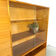 Vintage wooden sideboard with sliding glass doors and drawers